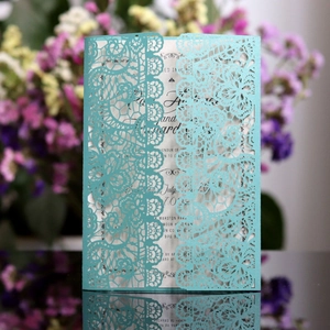 Elegant laser cut wedding invitation in tiffany blue lace design with pearlescent paper