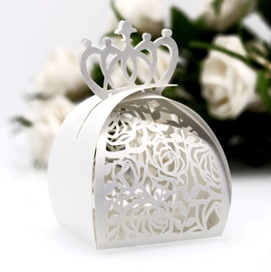 Elegant white laser-cut wedding favor box with crown handle and rose pattern design