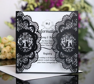 Laser cut wedding invitation card in classic black and white bird design with envelope