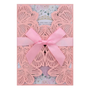 Elegant laser-cut pink wedding invitation with rose pattern, satin ribbon and inner card