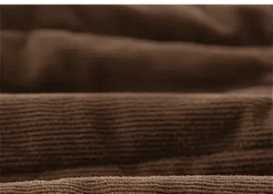 Detail of dark brown vertical ribbed fabric showing soft and thick winter knit texture