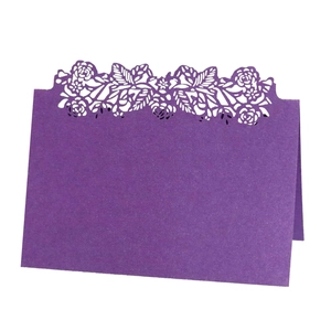 Elegant purple laser-cut rose floral place cards for wedding banquet table settings