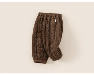 Detail of dark brown quilted winter pants for kids featuring vertical striped stitching