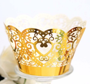 Golden laser-cut heart pattern cupcake wrappers for wedding dessert table decoration