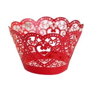 Red laser-cut cupcake wrapper with elegant hollow heart and vine patterns for wedding decor
