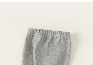 Detailed macro view of comfortable heather grey elastic waistband on soft knit baby pants