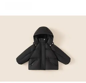Detail view of water-resistant black hooded down jacket with zipper pockets for kids