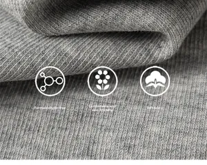 Macro detail of grey cotton knit fabric showing soft texture and skin-friendly weave