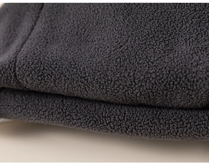 Detailed macro view of premium dark grey thick fleece lining for kids warm trousers