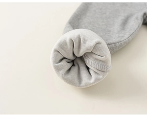 Macro shot of grey children's thermal pants showing thick fleece lining and cuff detail