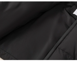 Detail view showing the premium inner lining and durable stitching of the black down jacket