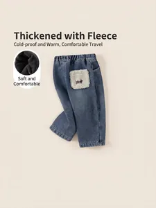 Fleece-lined kids denim pants in dark blue with embroidery and elastic waistband