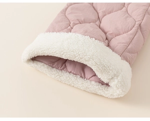 Detail of pink quilted pants showing soft white fleece lining for winter warmth