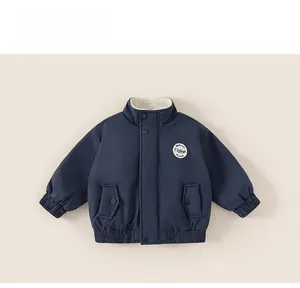 Detail of navy boy's jacket with sherpa fleece collar and vintage patch embroidery