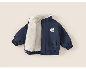 Detail view of boys fleece lined jacket with vintage patch and elastic windproof cuffs