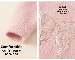 Detail of pink fleece sweater showing ribbed cuffs and sequined butterfly embroidery