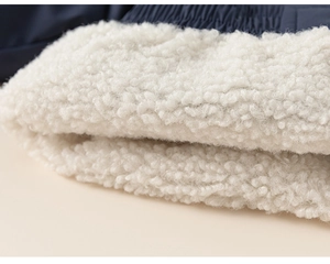Close-up of boys' winter jacket featuring thick warm white sherpa fleece lining