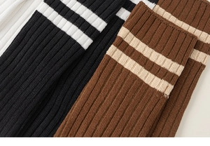 Macro shot of ribbed cotton socks with double stripe detail in classic preppy style
