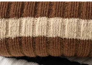 Close-up of soft ribbed cotton knee-high socks with striped pattern in brown and beige