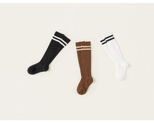 Three pairs of ribbed cotton knee-high socks for kids in black, brown and white colors