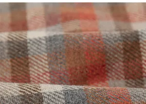 Close-up macro of soft plaid fabric texture for girls warm A-line winter dress
