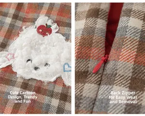 Detail of plaid dress showing sheep embroidery and hidden back zipper closure
