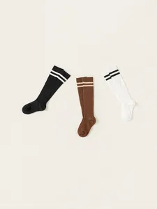Three-pack of children's cotton knee-high socks with stripes in black, white, and coffee