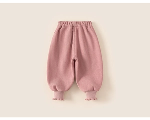 Detailed view of pink toddler pants featuring an elastic waist and frilled ruffle cuffs