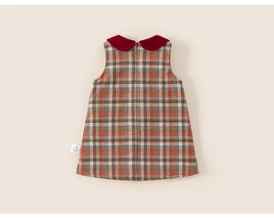 Detail view of the girls' plaid sleeveless dress with a red Peter Pan collar and back zipper