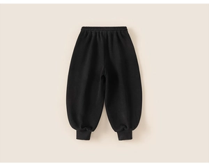 Detail view of children's black winter jogger pants with elastic waist and ribbed cuffs