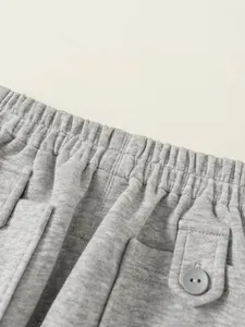 Pantalon de jogging gris clair pour enfants avec taille élastique et poche latérale à rabat