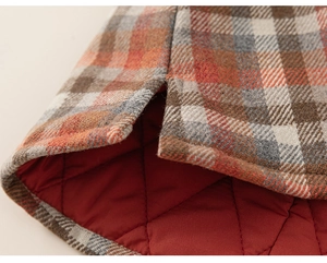 Macro detail of plaid wool dress with side split and quilted warm lining for girls