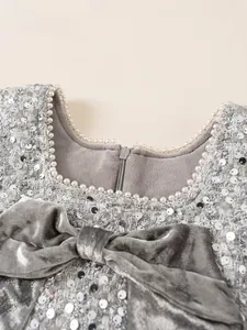 Girl's grey sequin party dress with velvet bow and pearl neckline detail