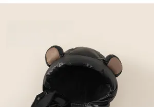 Close-up of black glossy padded jacket hood with cute brown bear ears for children