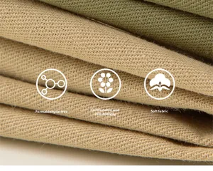 Detail of soft khaki and green knit fabric showing texture and skin-friendly quality