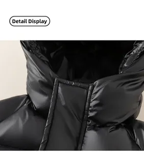 Close-up of black glossy padded jacket showing quilted hood and water-resistant fabric