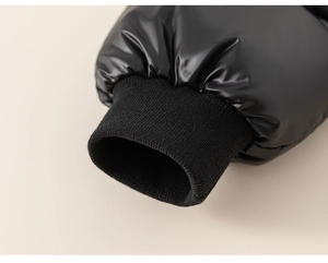 Close-up of windproof elastic ribbed cuffs on a glossy black children's winter jacket