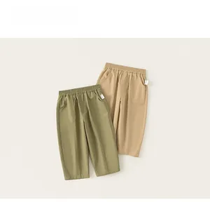Close-up of boys' casual cotton trousers with elastic waist and large front patch pockets