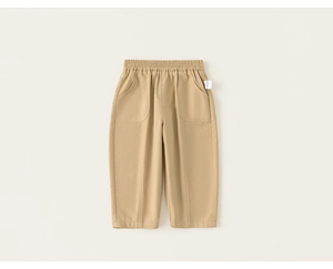 Detail of khaki kids trousers featuring elastic waistband and vertical pleated seams