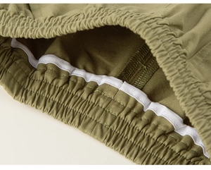 Detailed close-up of elastic waistband and stitching on boys' cotton casual pants