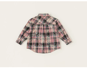 Detail view of the back of a plaid shirt with artistic bleached effect and curved hem