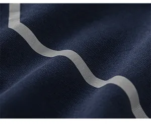 Detail of navy blue knit fabric with reflective wave pattern and high texture