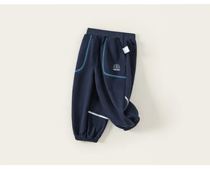 Detailed close-up of navy blue kids' cotton joggers with elastic waist and logo