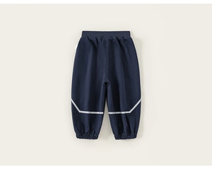 Close-up of kids navy joggers featuring elastic waistband and reflective knee stripes