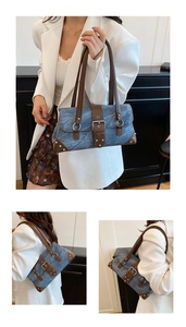 Detailed close-up showing blue denim texture, brown leather trim, and silver metal rivets