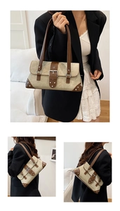 Detailed close-up of retro motorcycle bag featuring rivets and beige canvas texture