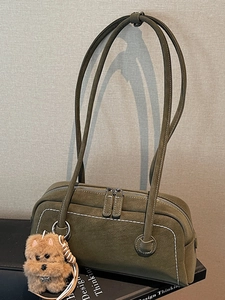 Deep green suede Boston shoulder bag with dual zippers and decorative white stitching detail