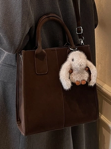 Minimalist large brown suede tote bag for women with a cute white rabbit pendant