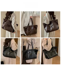 Detail view of coffee and black PU leather tote bags with metal buckle strap decorations