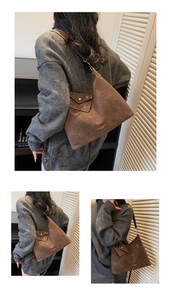 Détails du sac cabas marron en daim vintage avec poche avant et bandoulière réglable